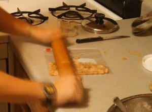 Moving so quickly her hands blurred, A crushes the peanuts with her rolling pin of might.