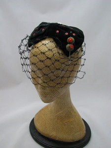 It's a cocktail hat...with a martini olive pin!