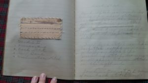 Each page has an example of her work glued on one page, and a description or definition of the technique on the facing page. 